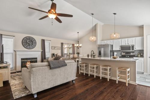 a living room with a couch and a kitchen at Time To Relax in Raleigh in Raleigh