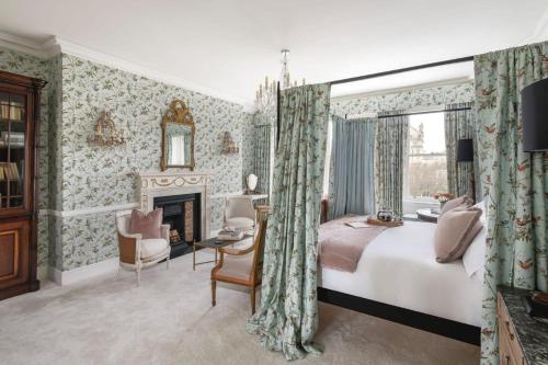a bedroom with a king sized bed and a fireplace at Former Prime Minister's Home in Bath