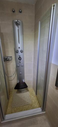 a bathroom with a shower with a cross on it at APARTAMENTO VISTASALRIO ADRIANA,Montanejos in Montanejos