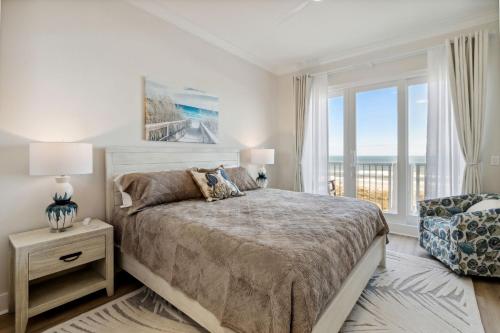 a bedroom with a bed with a view of the ocean at 58 Ocean Place - Luxury 2BR 2Ba oceanfront condo right next door to the Ritz Carlton in Fernandina Beach