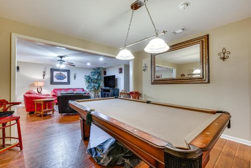 a living room with a pool table at Pool Table and Patio Cozy Lawrenceville Apt in Lawrenceville