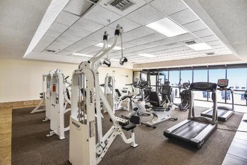 a gym with treadmills and cardio equipment in a building at Phoenix 10 Unit 1514 in Orange Beach