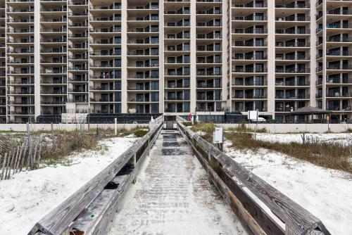 an apartment building on the beach in front of the sand at Phoenix 10 Unit 1514 in Orange Beach