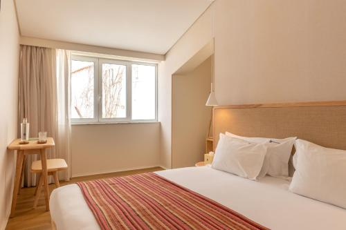 Кровать или кровати в номере Praia FLH Hotels Ericeira