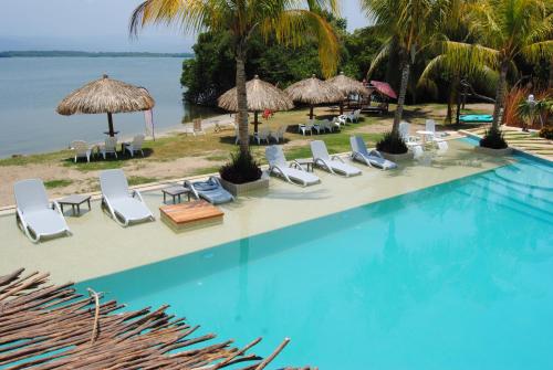 an image of a swimming pool at a resort at Rojo Manglar Acapulco in Acapulco