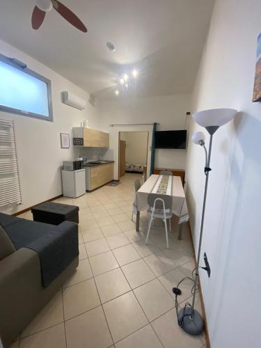 a living room with a couch and a table at Monolocale Le fate in Bentivoglio