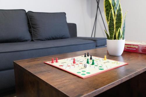 a board game on a table in a living room at Apartment-Peter in Finsterwalde