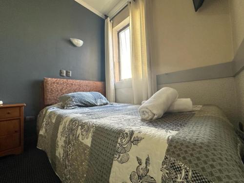 Кровать или кровати в номере Hotel Vitali