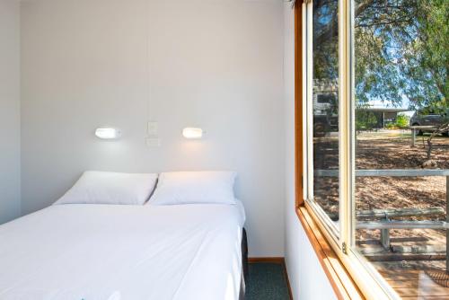 Ένα ή περισσότερα κρεβάτια σε δωμάτιο στο Echo Holiday Parks - Naracoorte
