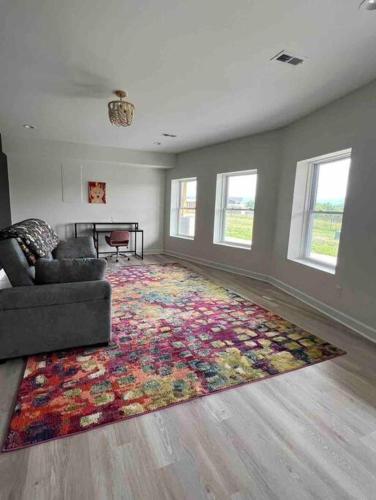 a living room with a couch and a colorful rug at Sunset Haven in Front Royal
