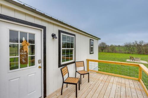two chairs sitting on a deck with a door at Fishing Pond Access Pet-Friendly Lorena Studio in Lorena