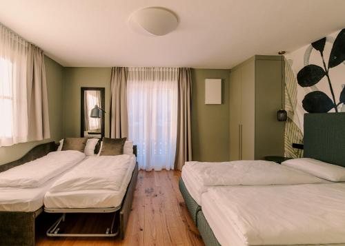 Ένα ή περισσότερα κρεβάτια σε δωμάτιο στο The Nest – 85 qm apartment - Mountain, Ski, Relax