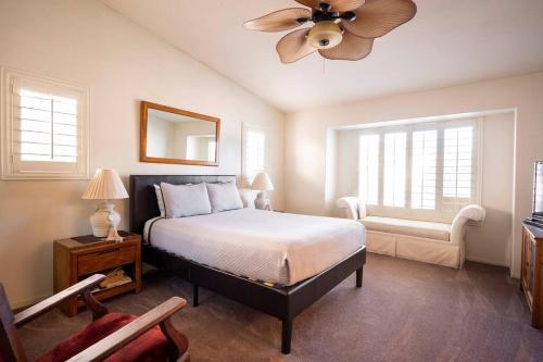 a bedroom with a bed and a ceiling fan at South point MGM 7 mi. LV Raiders, Adults Only in Las Vegas