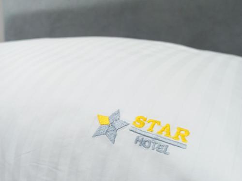a star hotel logo on a white shirt at Star Hotel in Tirana