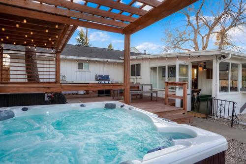 a hot tub on the patio of a house at Best Experience in Denver HOT TUB and FIRE PIT 4 miles to DT in Denver