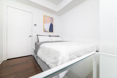 Ένα ή περισσότερα κρεβάτια σε δωμάτιο στο Presidential Suite Heart of Downtown with Stunning View