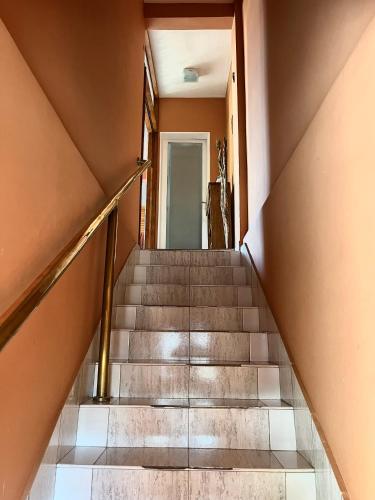 a staircase in a house with concrete stairs at CardON Apart in San Fernando del Valle de Catamarca