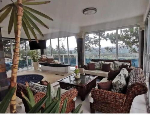 a living room with a couch and a table at villa Doña rosa in Concepción de La Vega