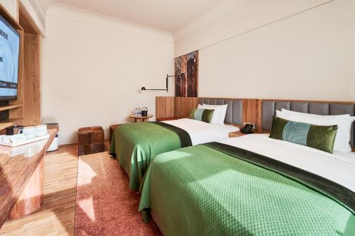 Postel nebo postele na pokoji v ubytování Panda Hotel