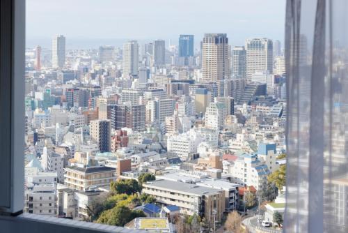 a view of a city from a skyscraper at ANA Crowne Plaza Kobe by IHG in Kobe