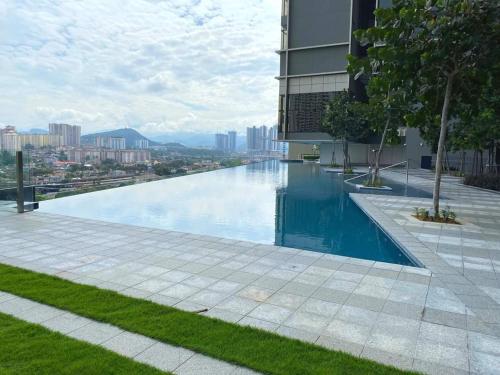 a swimming pool on the side of a building at PAVILION EMBASSY KLCC By ELITE HOST in Kuala Lumpur