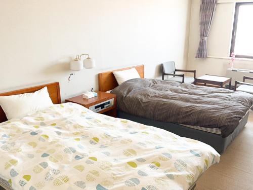 a bedroom with two beds in a room at Hotel Royal Kitami - Vacation STAY 04905v in Kitami