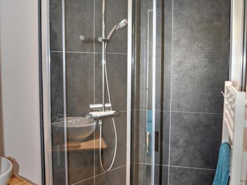 a bathroom with a shower with a sink at Gîte Chédigny, 3 pièces, 4 personnes - FR-1-381-480 in Chédigny