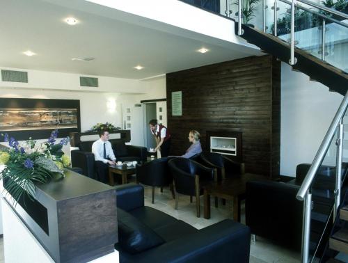 a group of people sitting in a restaurant at Ashbourne House Hotel in Ashbourne