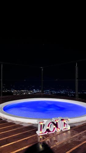 a large blue arena with the word love on it at Glamping Ríos Voladores Pereira in Pereira