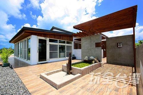 a large house with a deck with at Kenting Xia Ye B&B in Hengchun