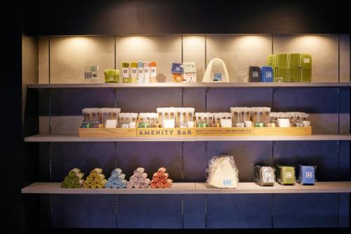 a shelf filled with lots of different items on at 3s HOTEL ATSUGI in Atsugi