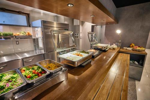 a buffet line with many different types of food at 3s HOTEL ATSUGI in Atsugi