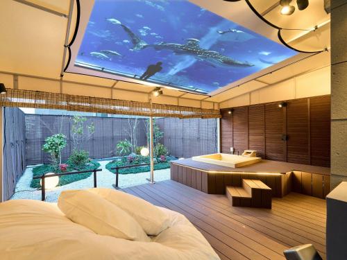 a bedroom with a view of a bathroom with a swimming pool at KONJAKUSO Osaka Bentencho "OKUJO-TEIEN" Rooftop Garden in Osaka