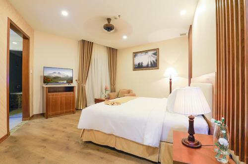 Postel nebo postele na pokoji v ubytování Ladalat Hotel