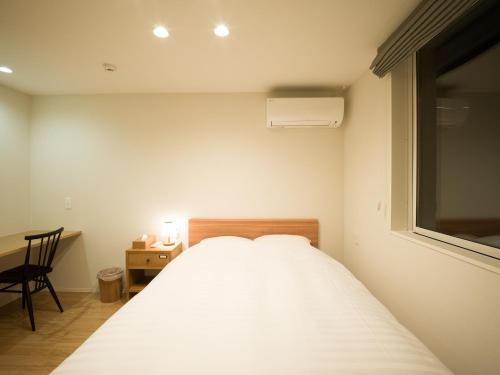 Postel nebo postele na pokoji v ubytování Rakuten STAY HOUSE x WILL STYLE Yufuin Kawakami