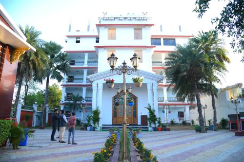 a building with a street light in front of it at Hotel Harsh Garden in Begusarai