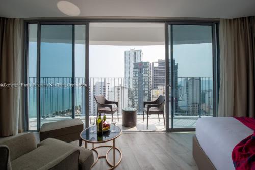 a hotel room with a view of a city at HD Panorama Nha Trang Condotel in Nha Trang