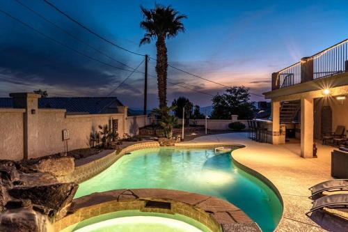 a swimming pool in the backyard of a house at HavaMemorable Stay Pool Spa Firepit VIEWS! in Lake Havasu City