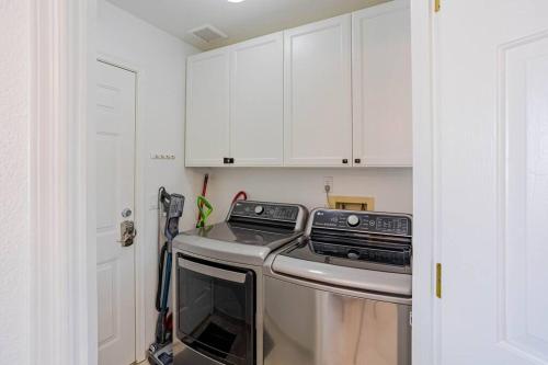 a kitchen with a stove and a dishwasher at HavaMemorable Stay Pool Spa Firepit VIEWS! in Lake Havasu City