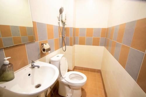 a bathroom with a white toilet and a sink at Sun Inns Hotel Kota Laksamana Melaka in Melaka