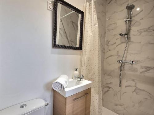 a bathroom with a shower and a toilet and a sink at Road Stop Studio *Paris*Disney*Gare* in Chelles