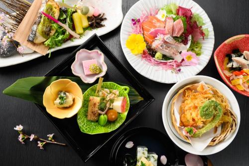 a group of plates of food on a table at Hotel Asyl Nara in Nara