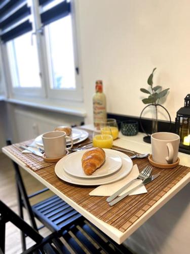 a table with a plate of food on top of it at BLACK TOUCH STUDIO - FIBRE*PARKING*NEAR BASEL in Saint-Louis