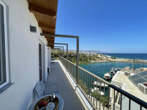 a balcony with a view of the water at Harbour lights by Smaris Collection in Sissi