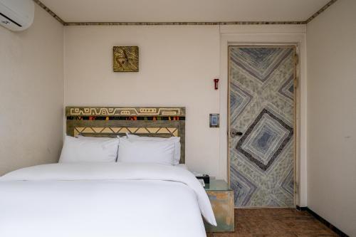 Postel nebo postele na pokoji v ubytování Hotel Aria