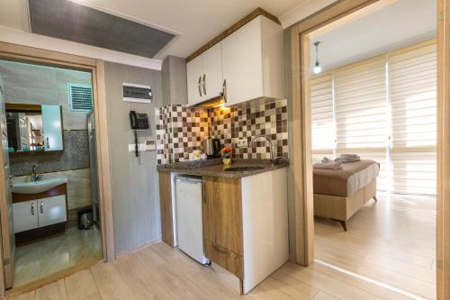 a kitchen with a counter and a sink in a room at Alya Boutique Hotel in Trabzon