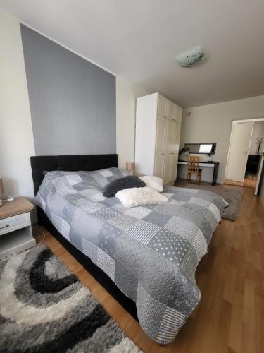 a bedroom with a large bed in a room at Long Holiday Apartment in Kuressaare