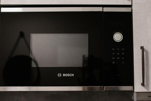 a microwave oven sitting on top of a counter at Modern Luxury Apartment Vienna in Vienna