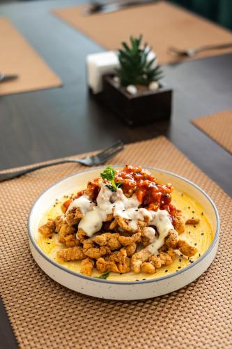 a plate of food sitting on a table at Treebo Sunheads in Panaji
