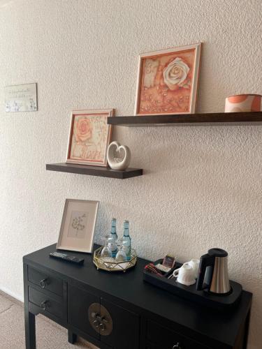 a black desk with a laptop on top of it at Landhaus Pusteblume in Quedlinburg